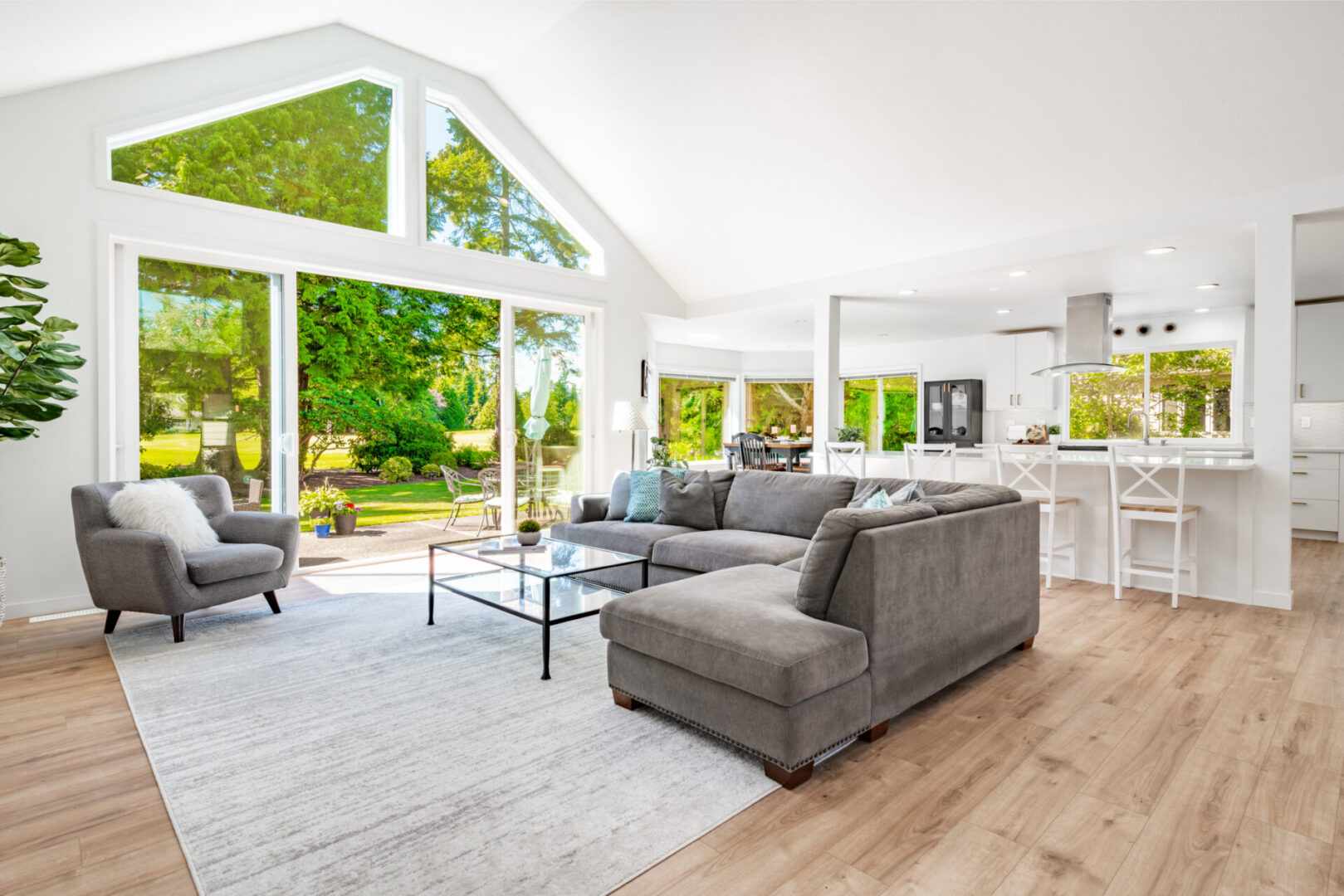Spacious living room with large windows.